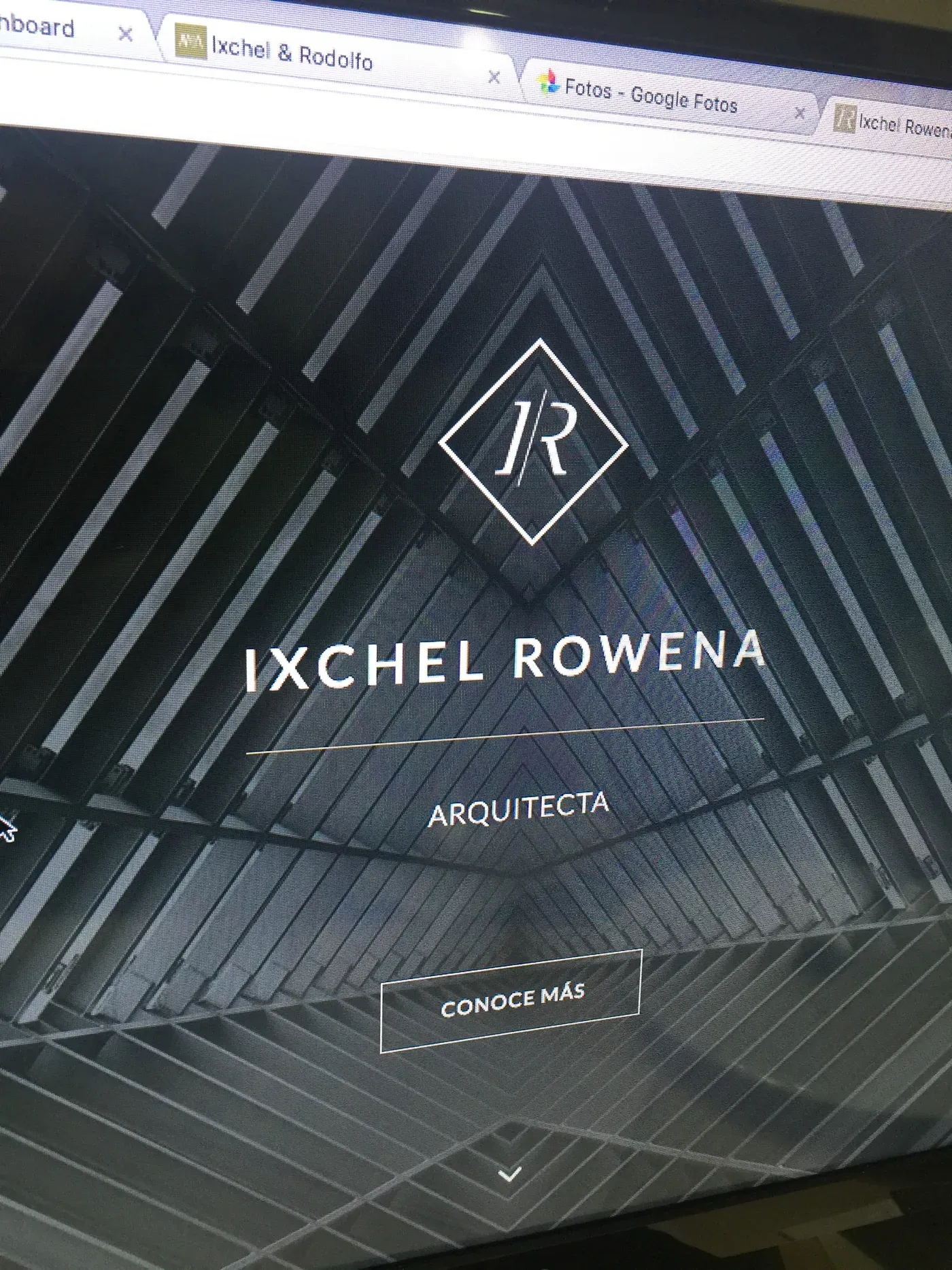A client architecture website shown on a monitor.