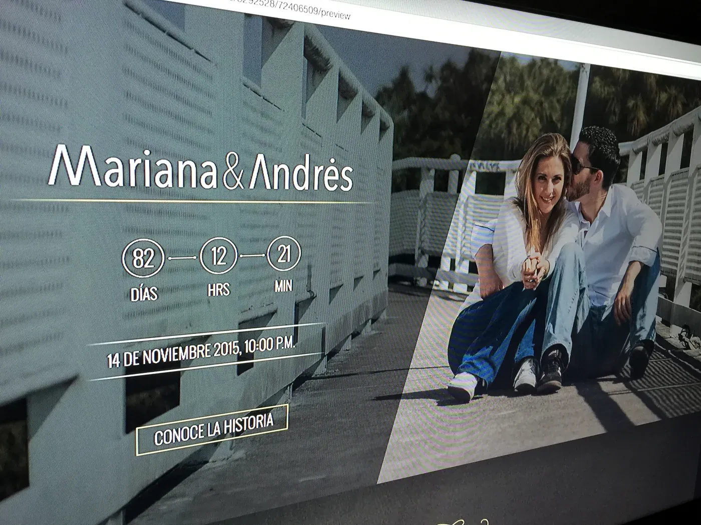 A wedding website landing page on a monitor.
