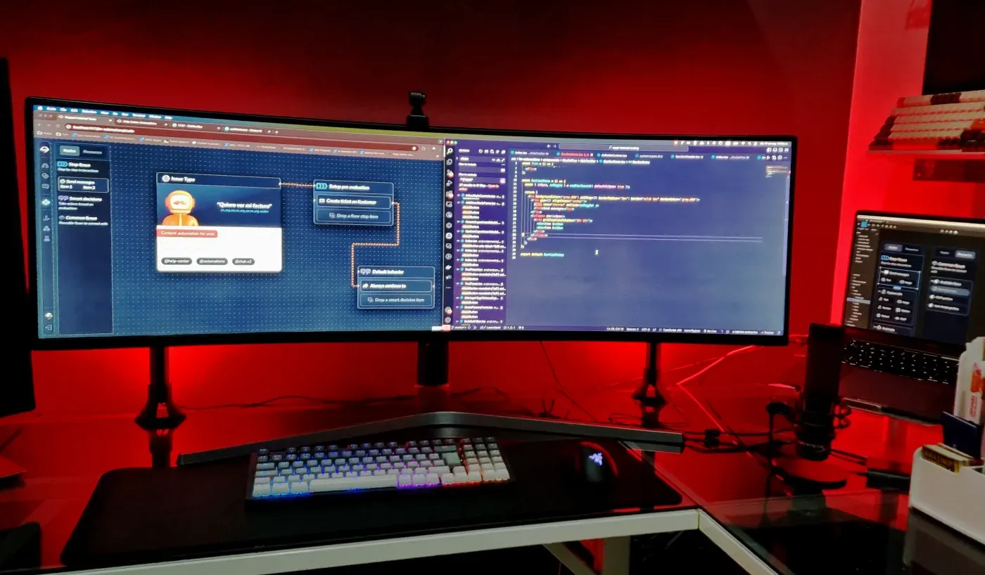 An agent workflow being built beside its code on an ultrawide display.